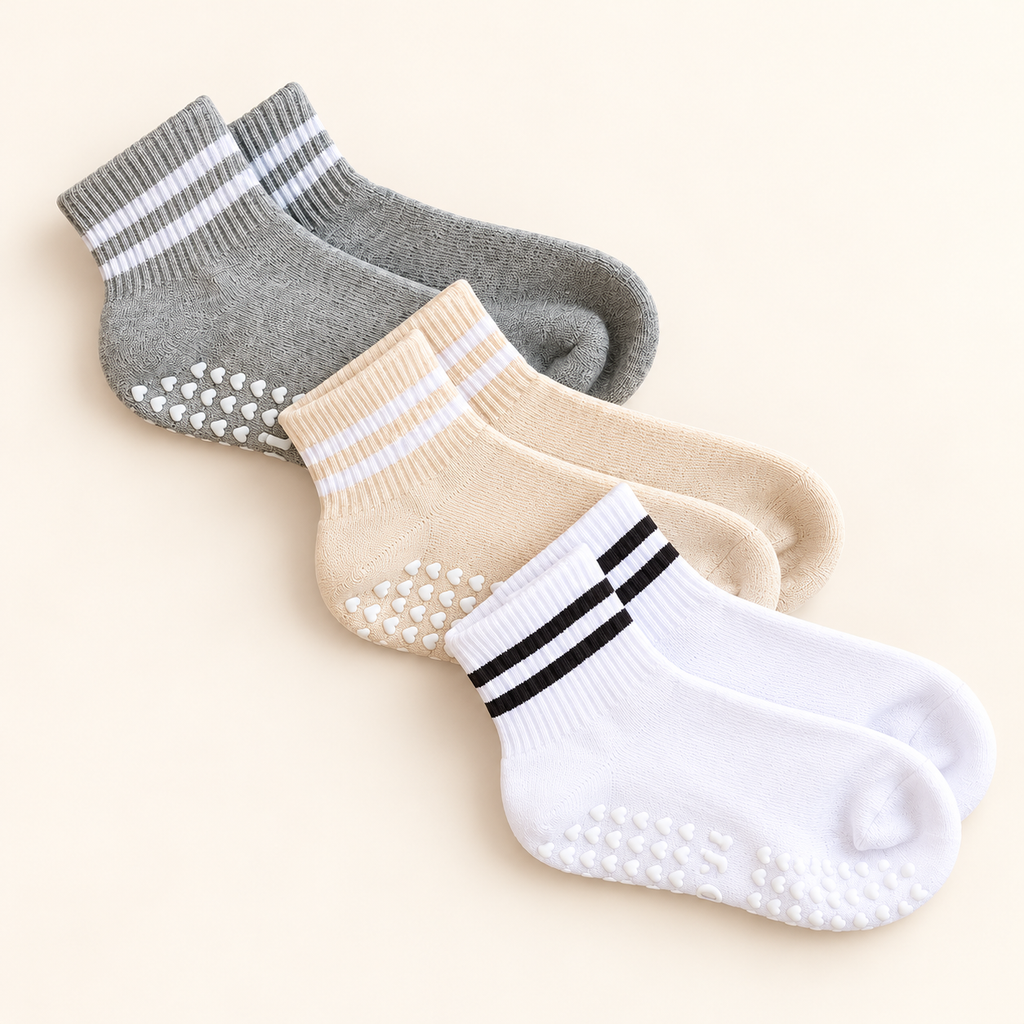 The Basic Bae Trio promotional image showing three neutral pairs of grip socks